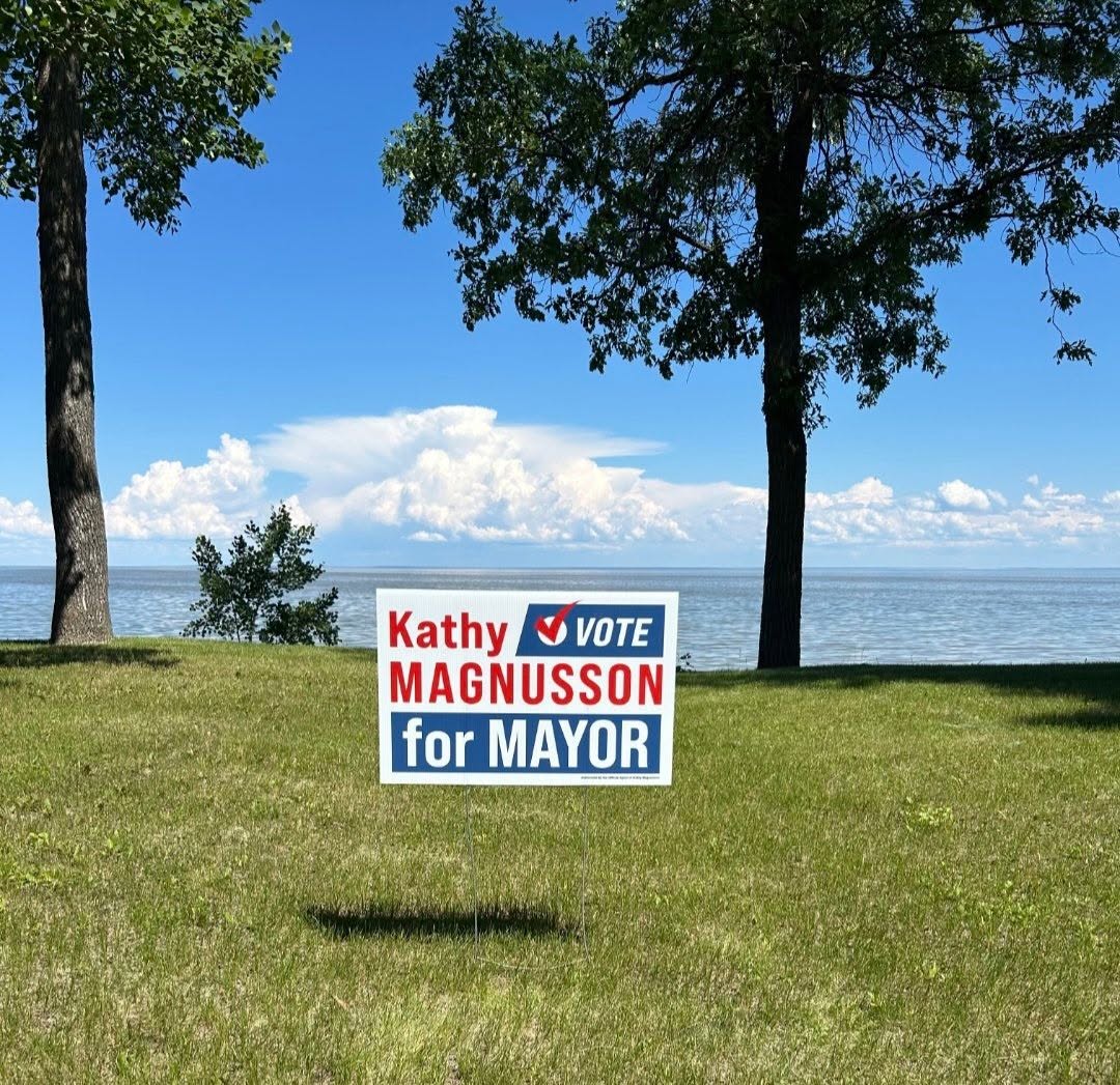 Kathy Magnusson for Mayor lawn sign on the Dunnottar lakeshore